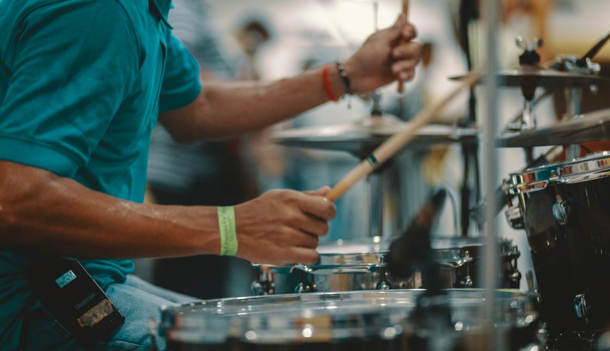 man playing acoustic drum