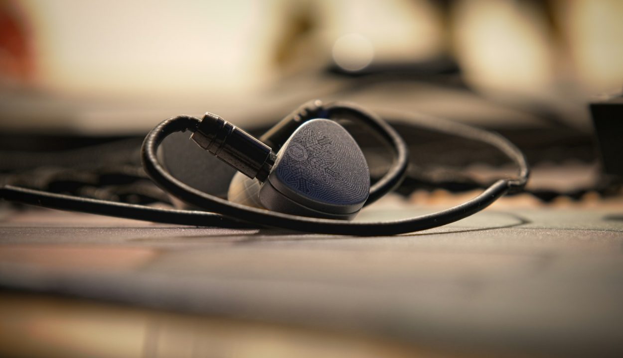 a pair of ear buds sitting on top of a table